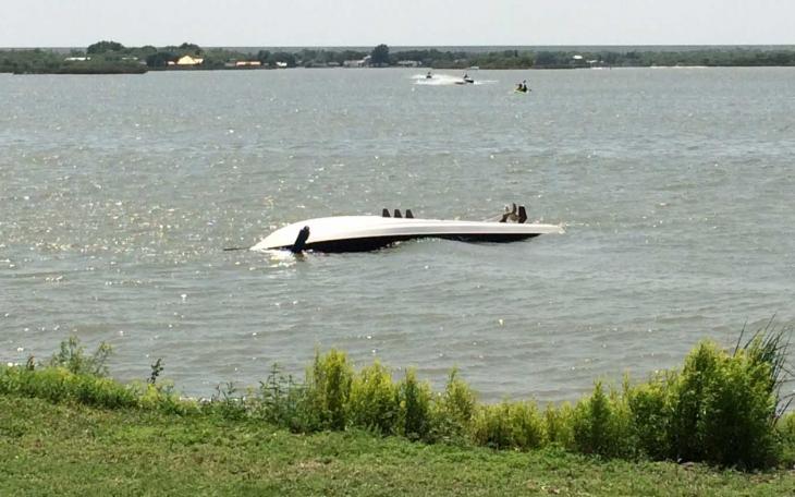 A speedboat flips and capsizes on Lake Nasworthy on Saturday, June 14. (LIVE! Photo/John Basquez)