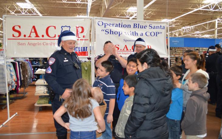 Officer Brian Bylsma visited with the participant of this year's Operation Blue Santa (LIVE Photo by Lauren Lopez)