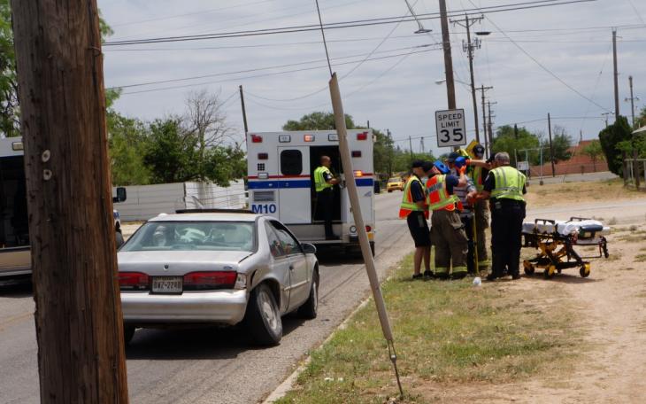 First responders immobilize driver injured in crash at 19th St. and MLK in San Angelo on Friday. (LIVE! Photo/John Basquez)