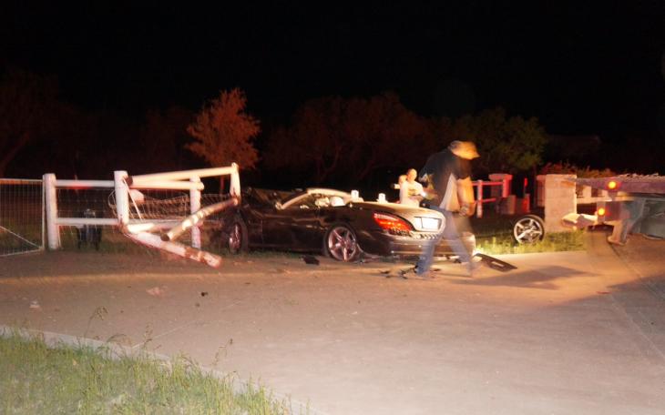 A Mercedes Convertible crashes into grand entrance in Butler Farms. (LIVE! Photo/John Basquez)