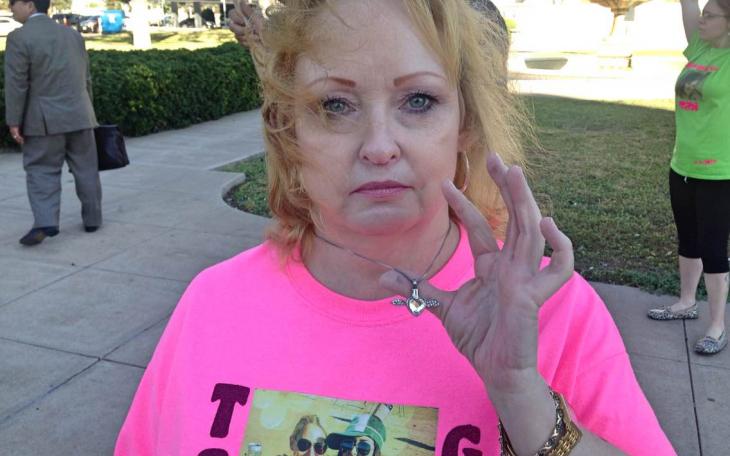 Karen Freeman holds up a pendant containing the ashes of her deceased daughter Tabitha, who was murdered on Sept. 1, 2013. (LIVE! Photo/Chelsea Reinhard)