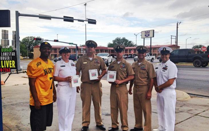 Navy personnel sold Krispy Kreme donuts to raise money for retirees on Friday morning. (LIVE! Photo/Chelsea Schmid)
