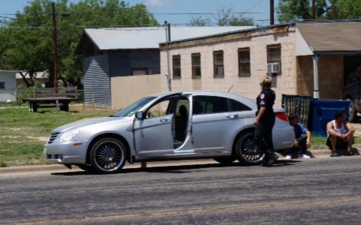 Police wait by Fitchett's Chrysler Sebring after he fled with a shotgun on June 6. (LIVE! Photo/John Basquez)
