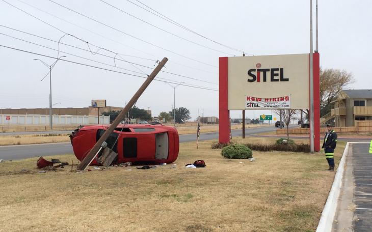 Rollover crash in front of Sitel on Dec. 7, 2014. (LIVE! Photo/John Basquez)