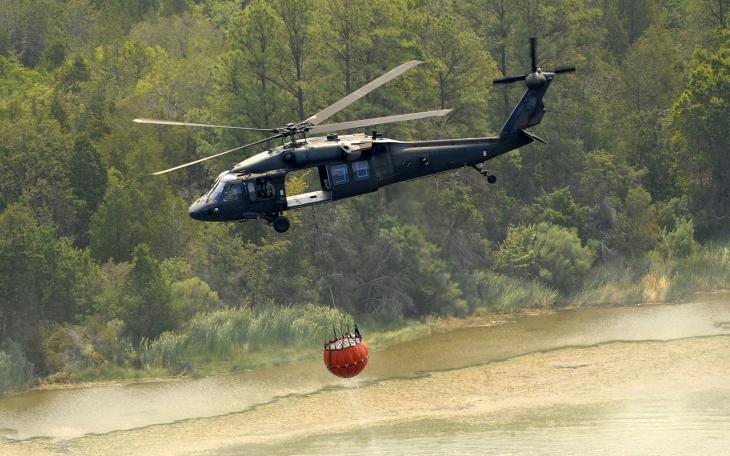 Texas National Guard helicopters battle wildfires in Bastrop in late 2011. (Contributed/Staff Sgt. Malcolm McClendon via Flickr)