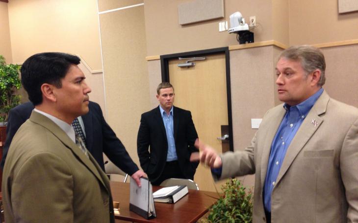 City Manager Daniel Valenzeula and Charles Young discuss the trash controversy after the press conference. (LIVE! Photo/Joe Hyde)