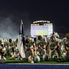 The Wall Hawks take a moment to pray before their state semifinal game against Gunter on Friday, Dec. 12, 2025, in Stephenville.