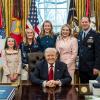 August Pfluger poses with his family and President Donald Trump on March 6, 2026, after his retirement from the U.S. Air Force.