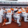 The Texas Longhorns huddle at the 2026 College World Series