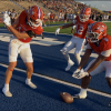 Central's Tucker Beaty does a golf celebration while Ellis Johnson (12) and Zey Johnson (8) look on after a touchdown against Abilene High on Friday, Aug. 28, 2026, at San Angelo Stadium.