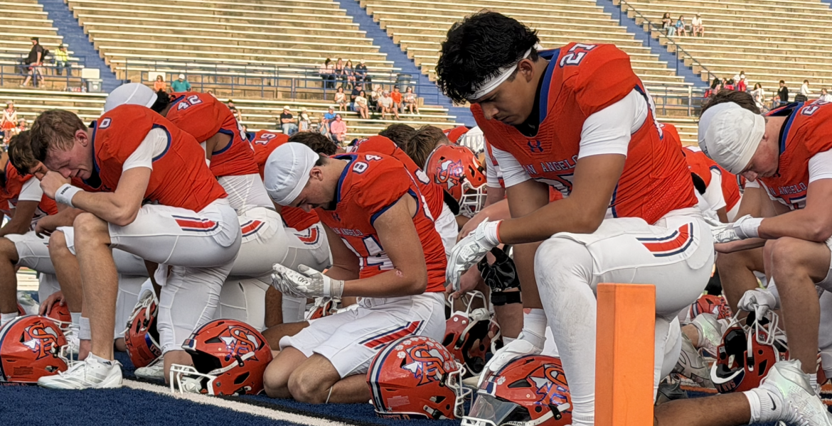 The San Angelo Central Bobcats pray before their game against the Abilene Cooper Cougars