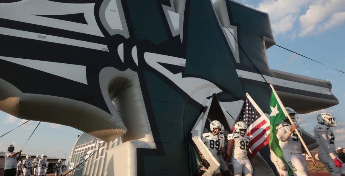 The Waxahachie Indians walk onto the field before a football game during the 2026 season.